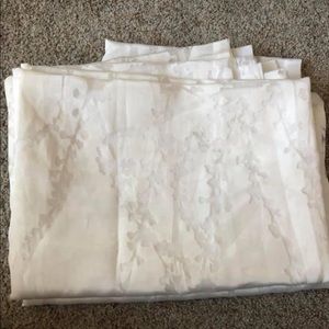 84” L sheer curtains pair with vines